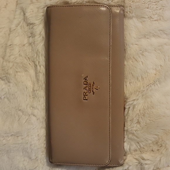 Prada Handbags - PRADA saffiano leather long wallet in nude and gold/white interior